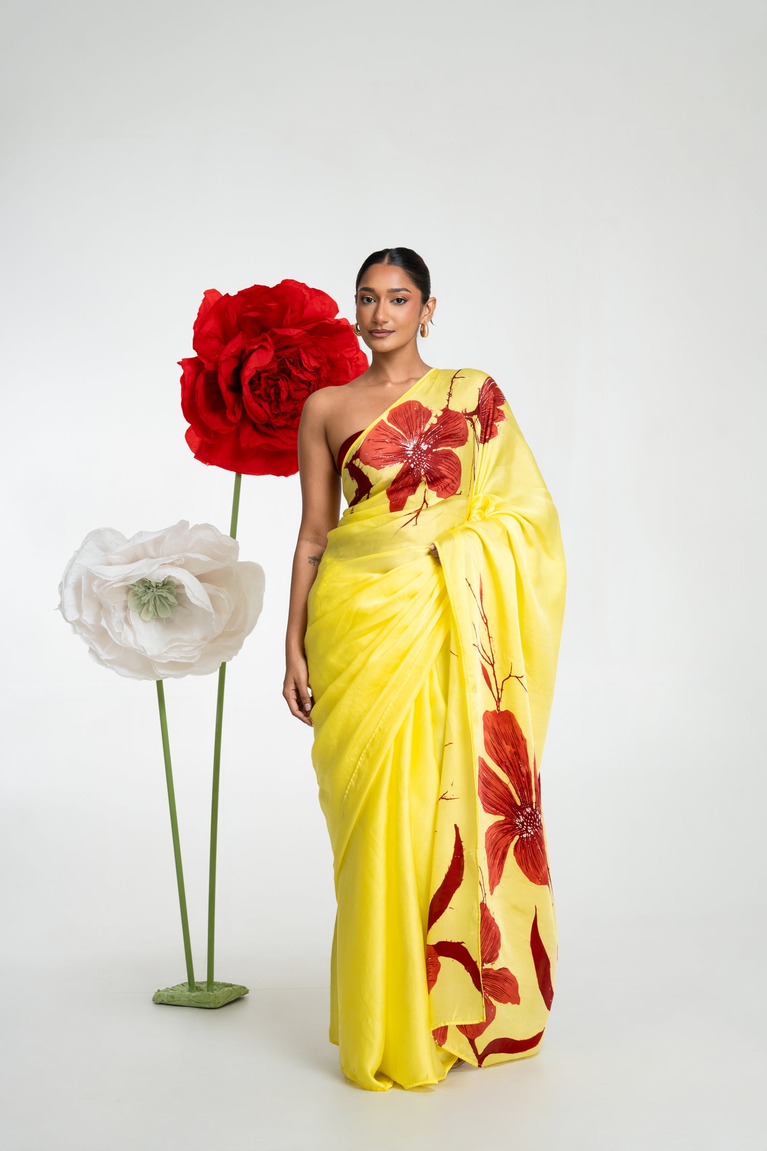 Siena yellow silk batik saree with maroon floral motifs and handcrafted beadwork by Colombo Batik